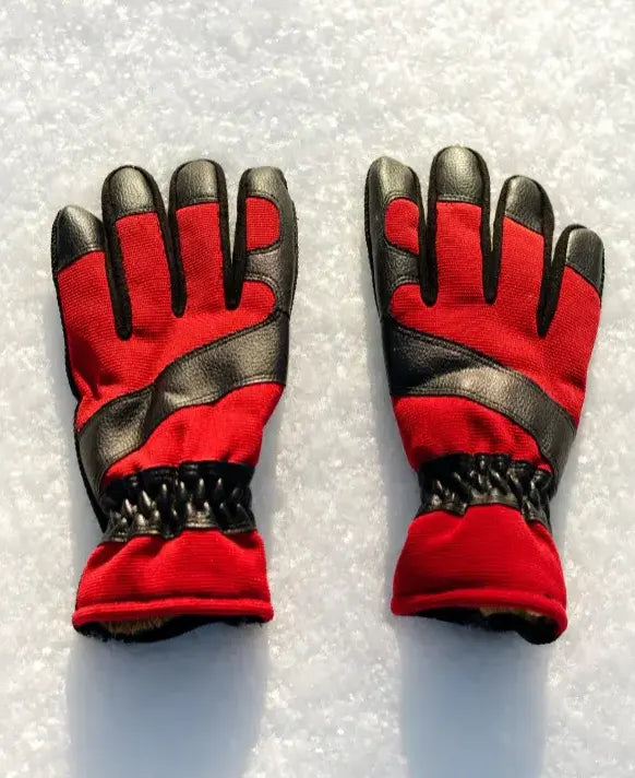 Pair of red and black gloves on a white background